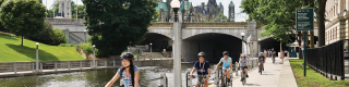 Students riding bikes along the Rideau Canal, cycling