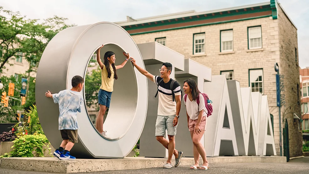 Family visit the Ottawa Sign in the ByWard Market