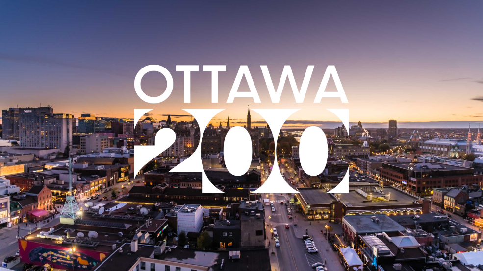 Skyline of Ottawa at night, with overlay logo "Ottawa 200".