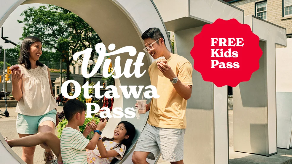 Family at the Ottawa Letters sign with overlay text that reads Visit Ottawa Pass - Free Kids Pass.