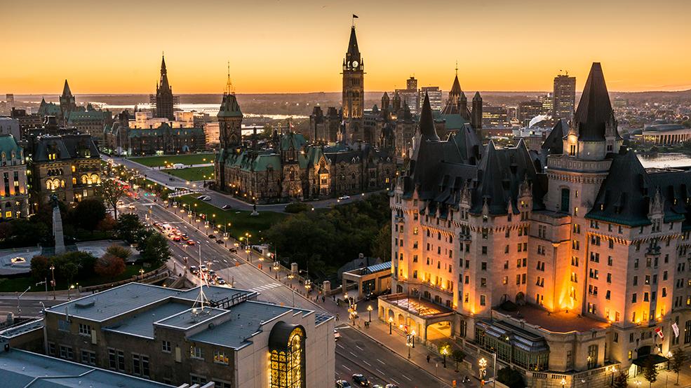 Panoramic view of downtown Ottawa with Parliament Hill, Fairmont Château Laurier and Government Conference Centre