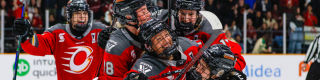 Team members of Ottawa Charge hug and celebrate win