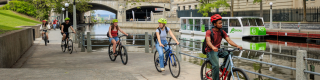 Student biking along Rideau Canal
